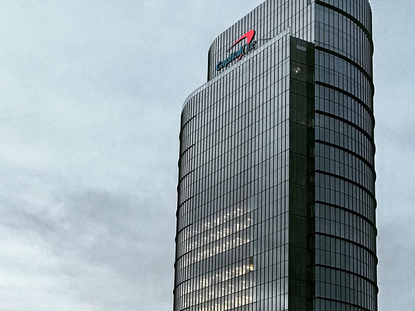 Capital One's headquarters tower in Tysons, Virginia, at dusk.